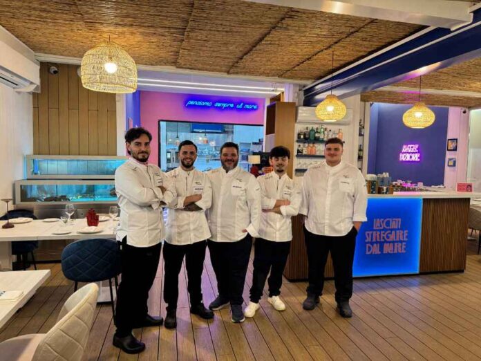 Giovanni Mele con lo staff